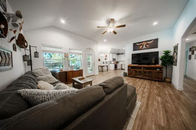 a living room with furniture and a flat screen tv
