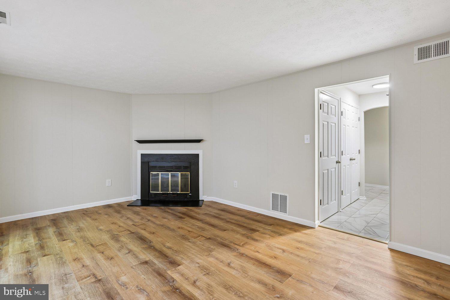 10804 Douglas Avenue Silver Spring, MD 20902 - Photo 34 of 46 Recreation room with wood burning fireplace