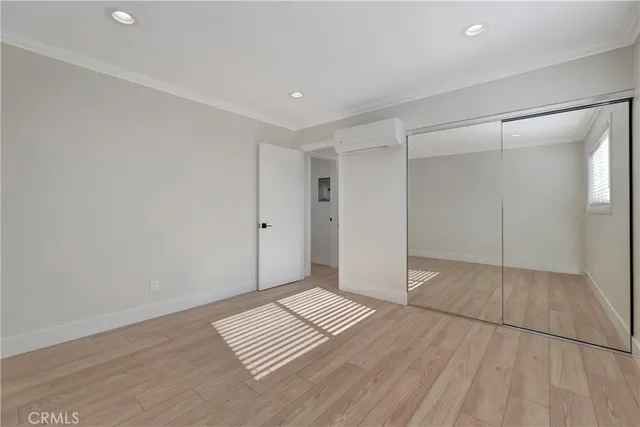 a bathroom with a bathtub shower sink vanity mirror and toilet
