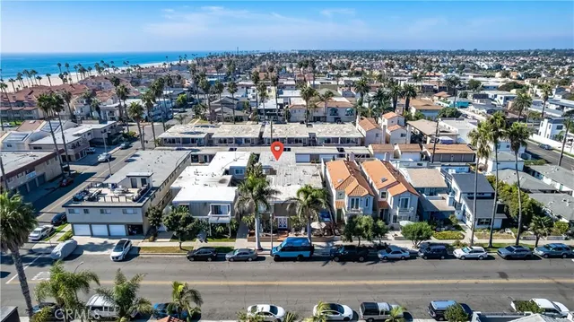 an aerial view of residential houses with outdoor space and swimming pool