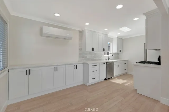a kitchen with white cabinets