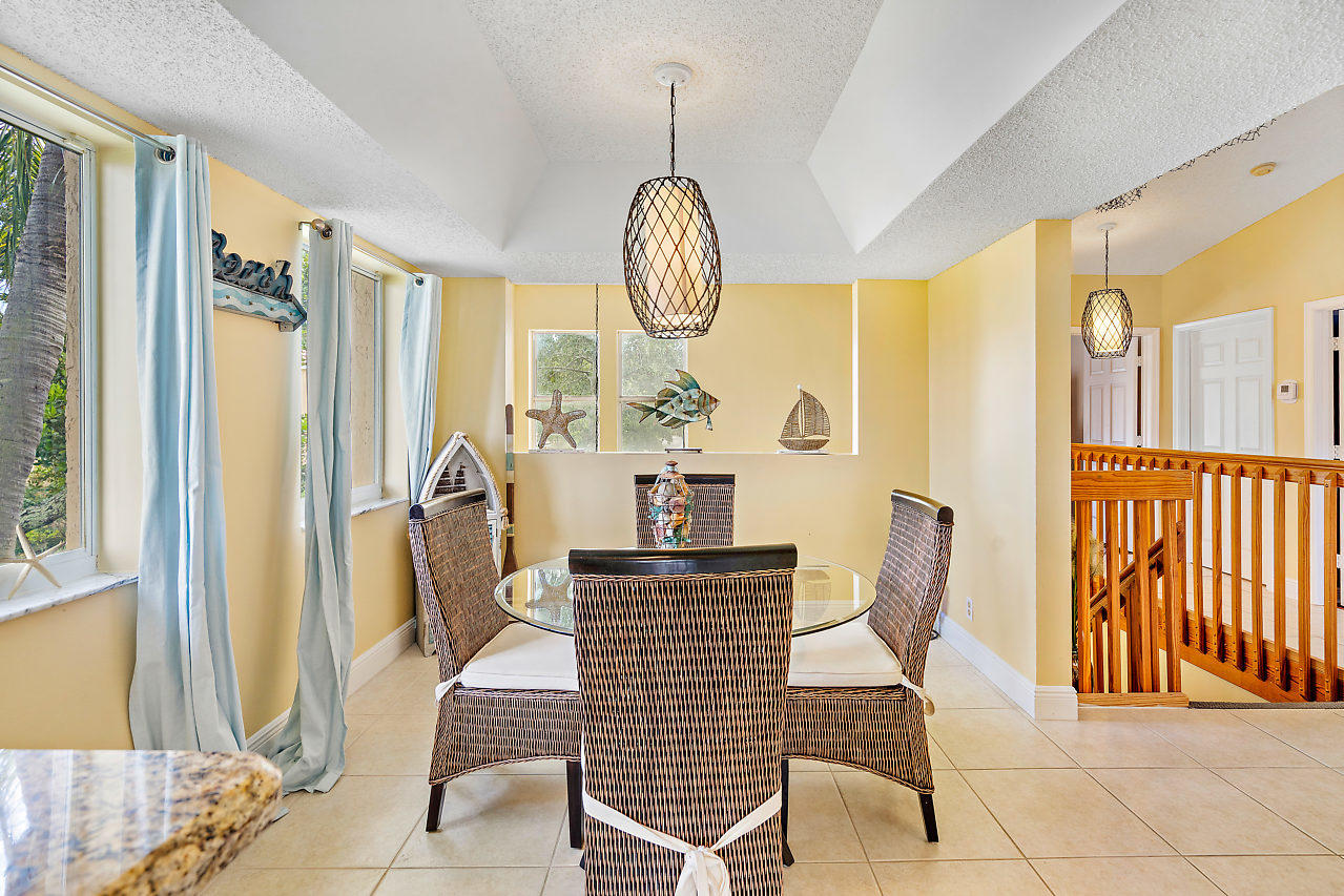 23122 Island View, Unit 6 Boca Raton, FL 33433 - Photo 16 of 38 a view of dining room with furniture and large windows
