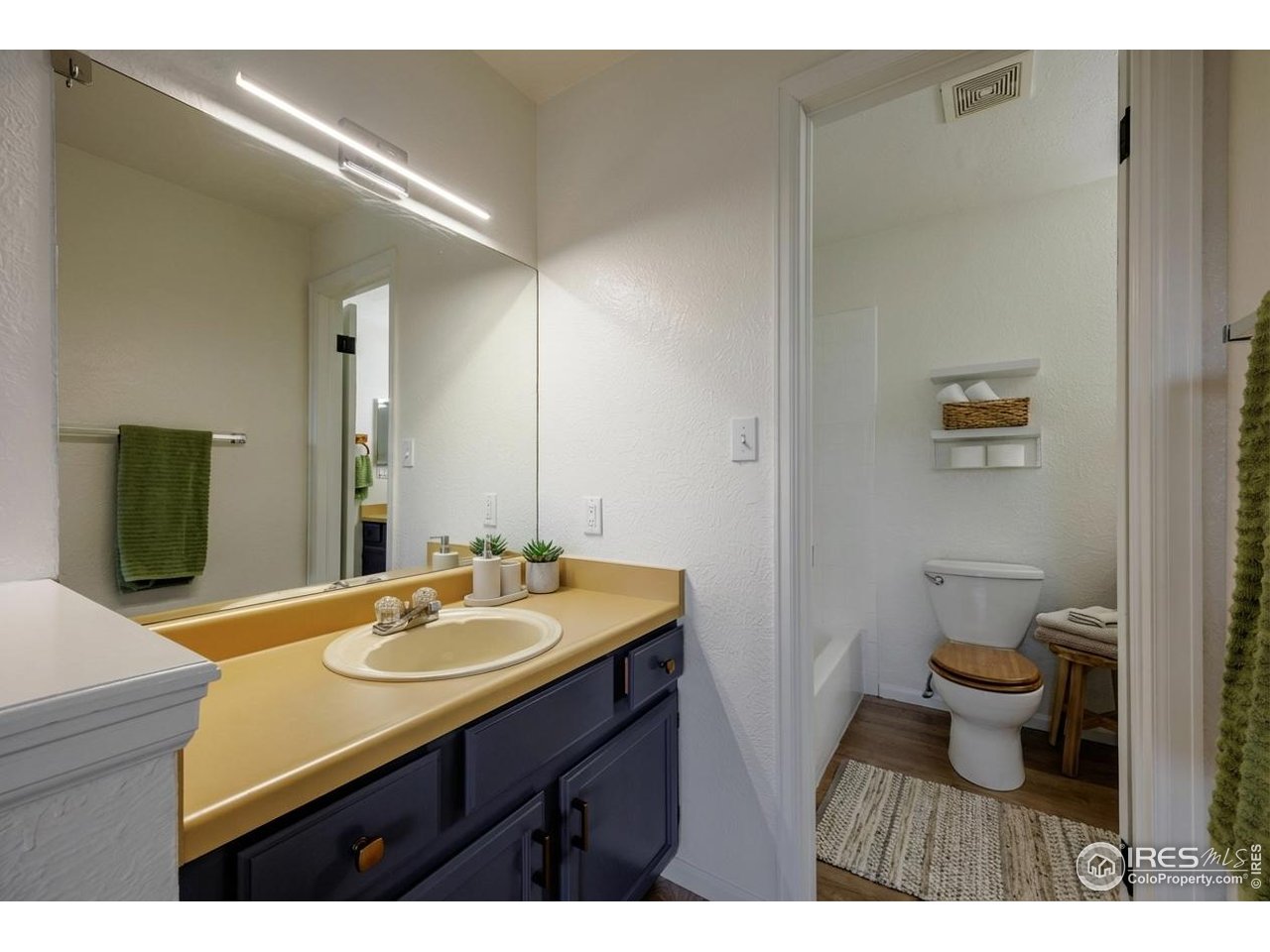 3295 34th Street, Unit 68 Boulder, CO 80301 - Photo 13 of 27 a bathroom with a sink and a mirror