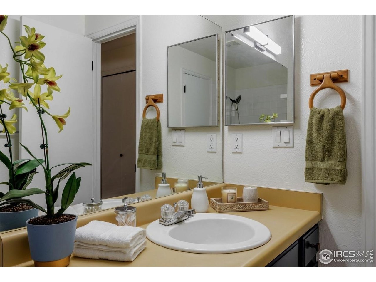 3295 34th Street, Unit 68 Boulder, CO 80301 - Photo 15 of 27 a bathroom with a sink and a mirror