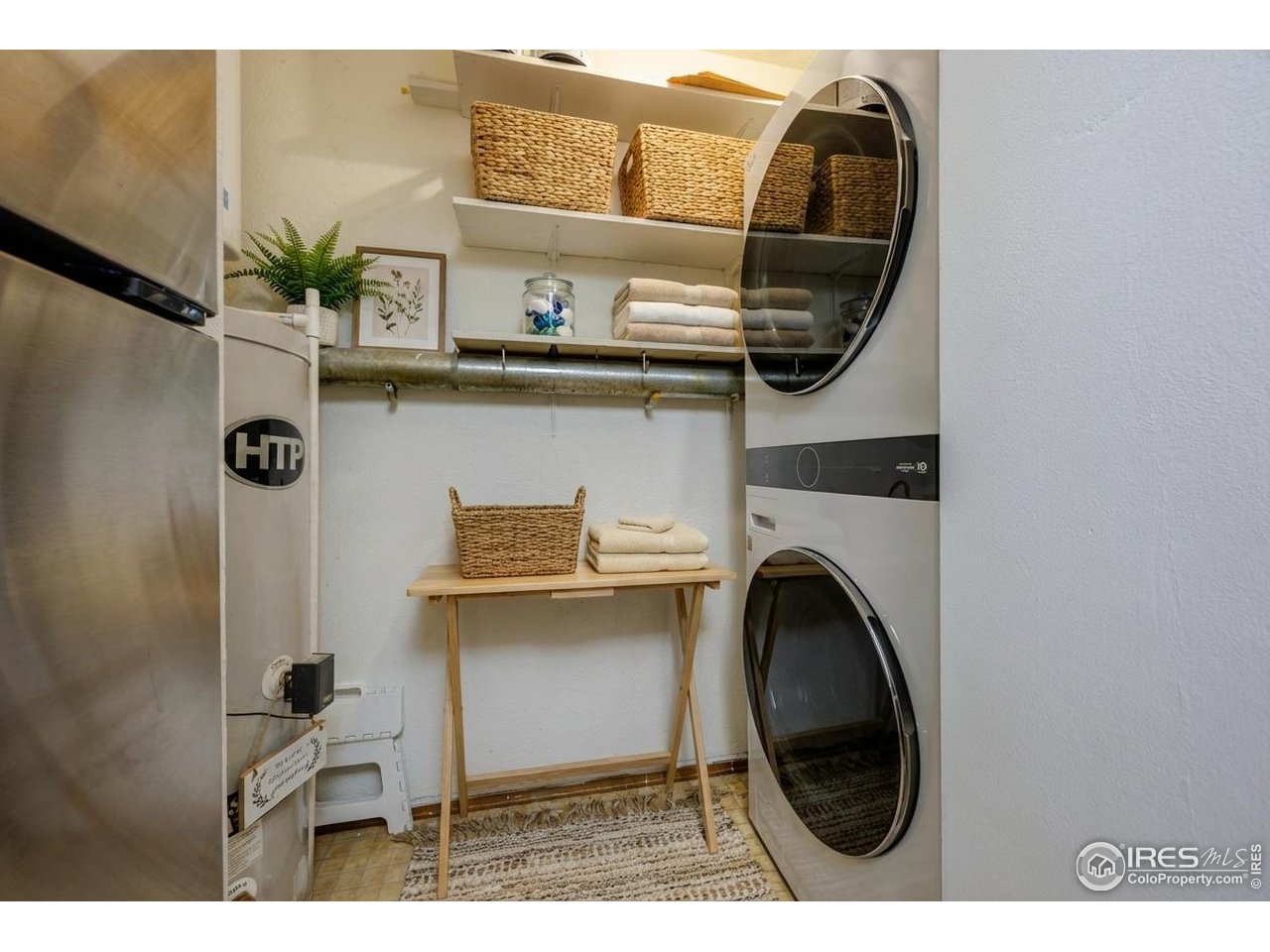 3295 34th Street, Unit 68 Boulder, CO 80301 - Photo 19 of 27 a view of a kitchen with a sink and a washer
