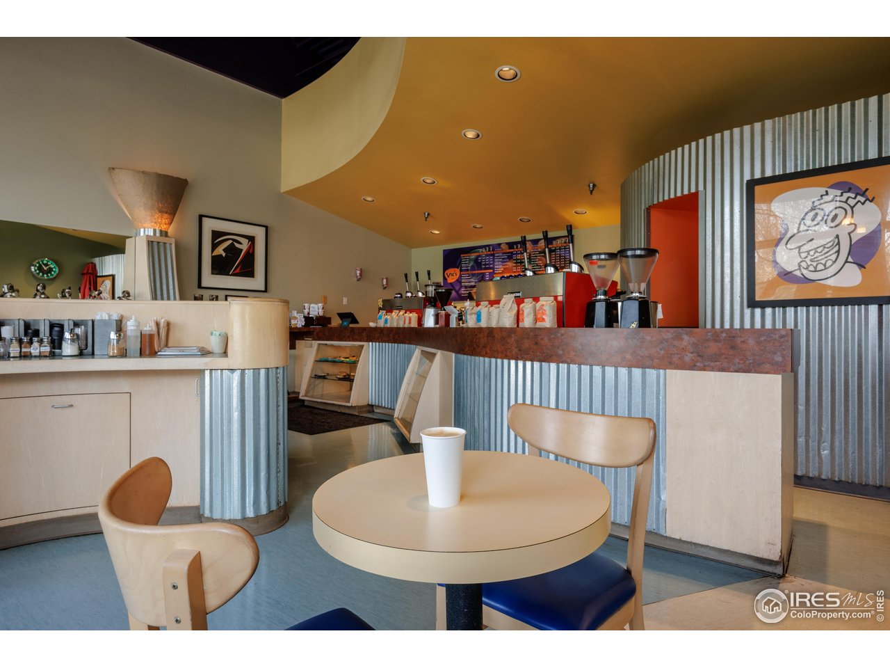 3295 34th Street, Unit 68 Boulder, CO 80301 - Photo 26 of 27 a kitchen with stainless steel appliances a table and chairs