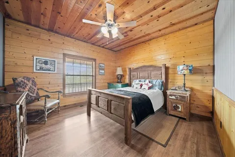 a bed room with a bed and a chair