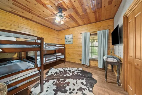 a bedroom with furniture and a window