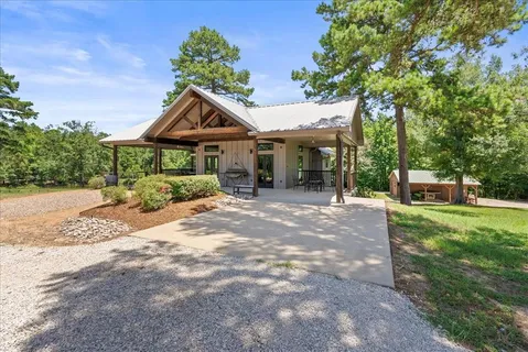 a front view of a house with a yard and a garage