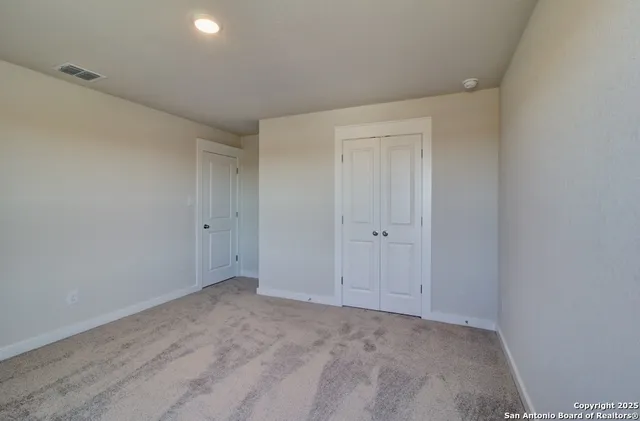 a view of empty room with windows