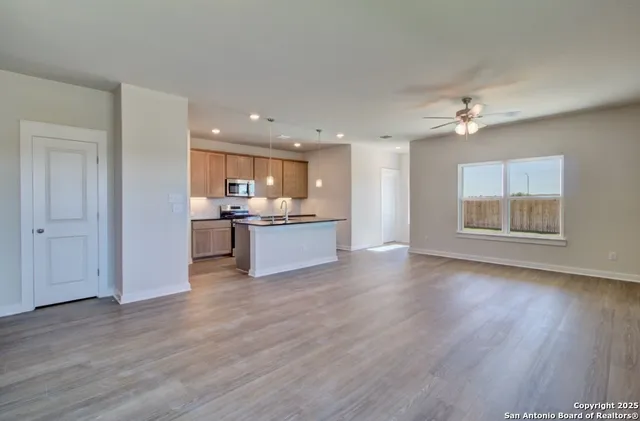 a view of kitchen with wooden floor and window