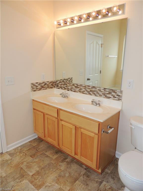 2124 Burton Run Road High Point, NC 27262 - Photo 16 of 29 Master Bath with double vanity and tile backsplash!