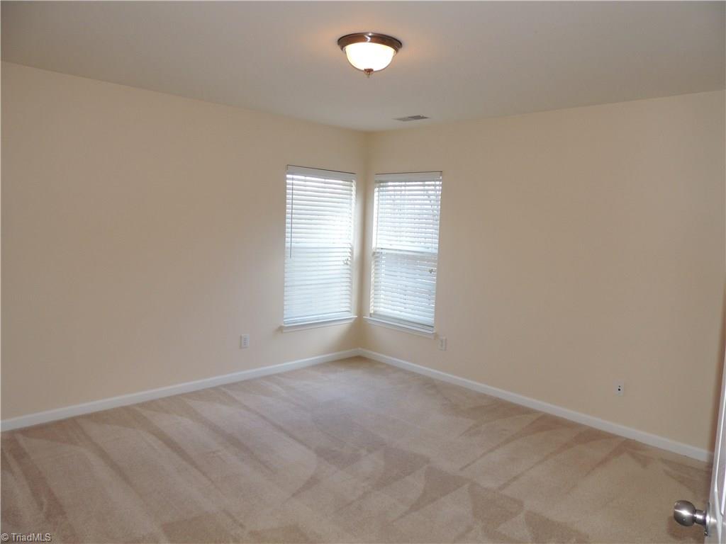 2124 Burton Run Road High Point, NC 27262 - Photo 22 of 29 This bedroom has 2 corner windows, carpet, and is spacious!