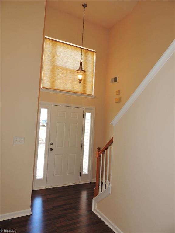 2124 Burton Run Road High Point, NC 27262 - Photo 4 of 29 Vaulted ceilings add a spacious feel to the entry! Note the beautiful lighting and laminate flooring!