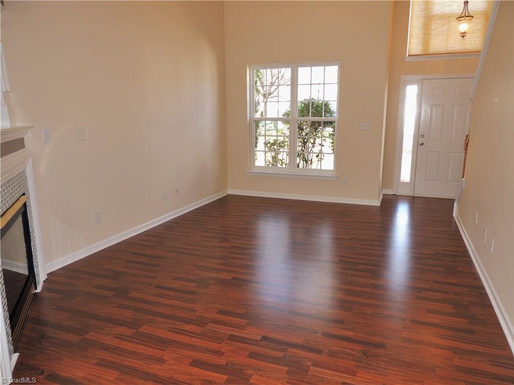 2124 Burton Run Road High Point, NC 27262 - Photo 6 of 29 Beautiful laminate flooring flows throughout the main level. Note a double window for added light.