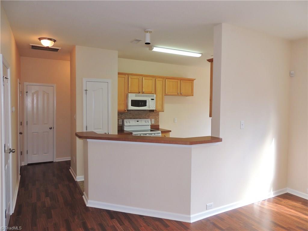 2124 Burton Run Road High Point, NC 27262 - Photo 10 of 29 Kitchen is open to the dining room features a bar area.