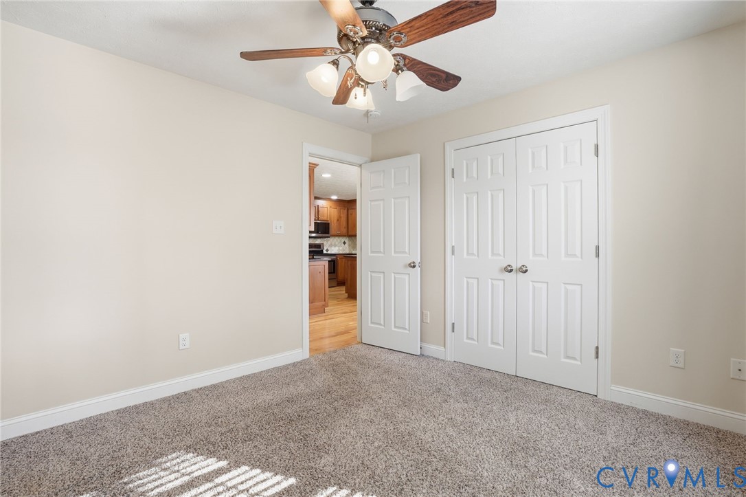 10326 Gould Hill Road Hanover, VA 23069 - Photo 25 of 43 a view of entryway and hall with a chandelier fan