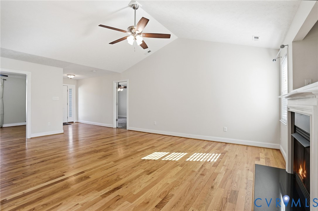 10326 Gould Hill Road Hanover, VA 23069 - Photo 8 of 43 a view of empty room with wooden floor and fan