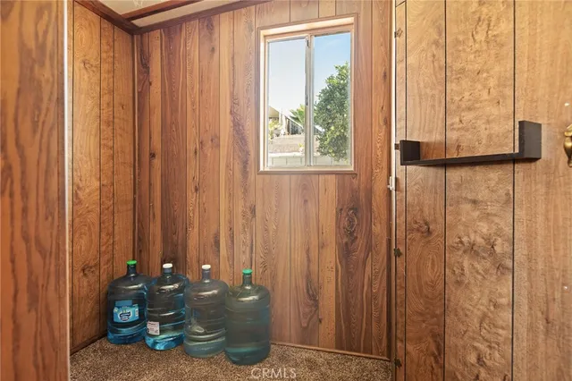 a bathroom with a shower curtain and a window