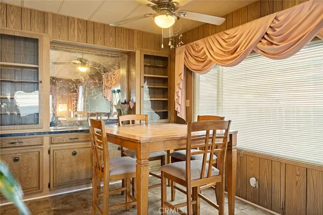 a view of a dining room with furniture and window