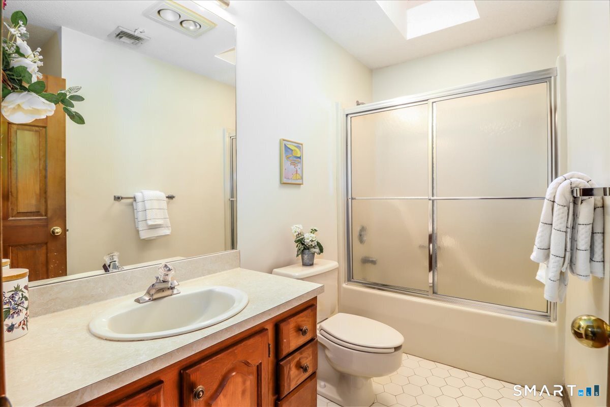 185 Quaker Farms Road Oxford, CT 06478 - Photo 21 of 40 a bathroom with a sink toilet and shower