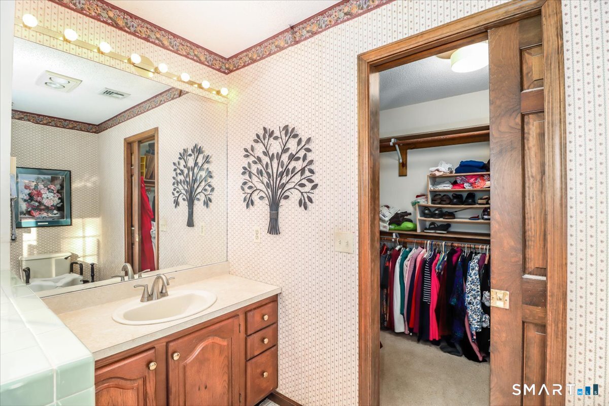 185 Quaker Farms Road Oxford, CT 06478 - Photo 27 of 40 a view of a bedroom from a hallway