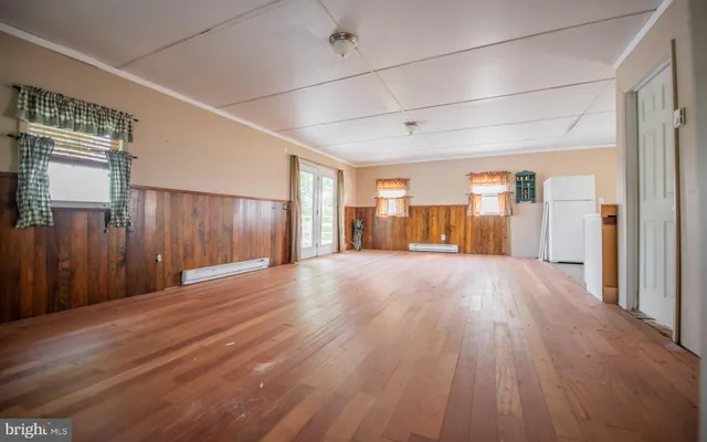 a view of a livingroom with wooden floor