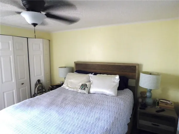 a bedroom with a bed and lamp