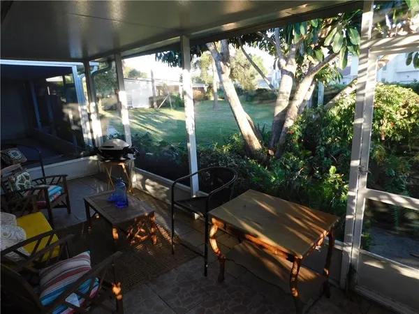 a view of a two chairs in the patio