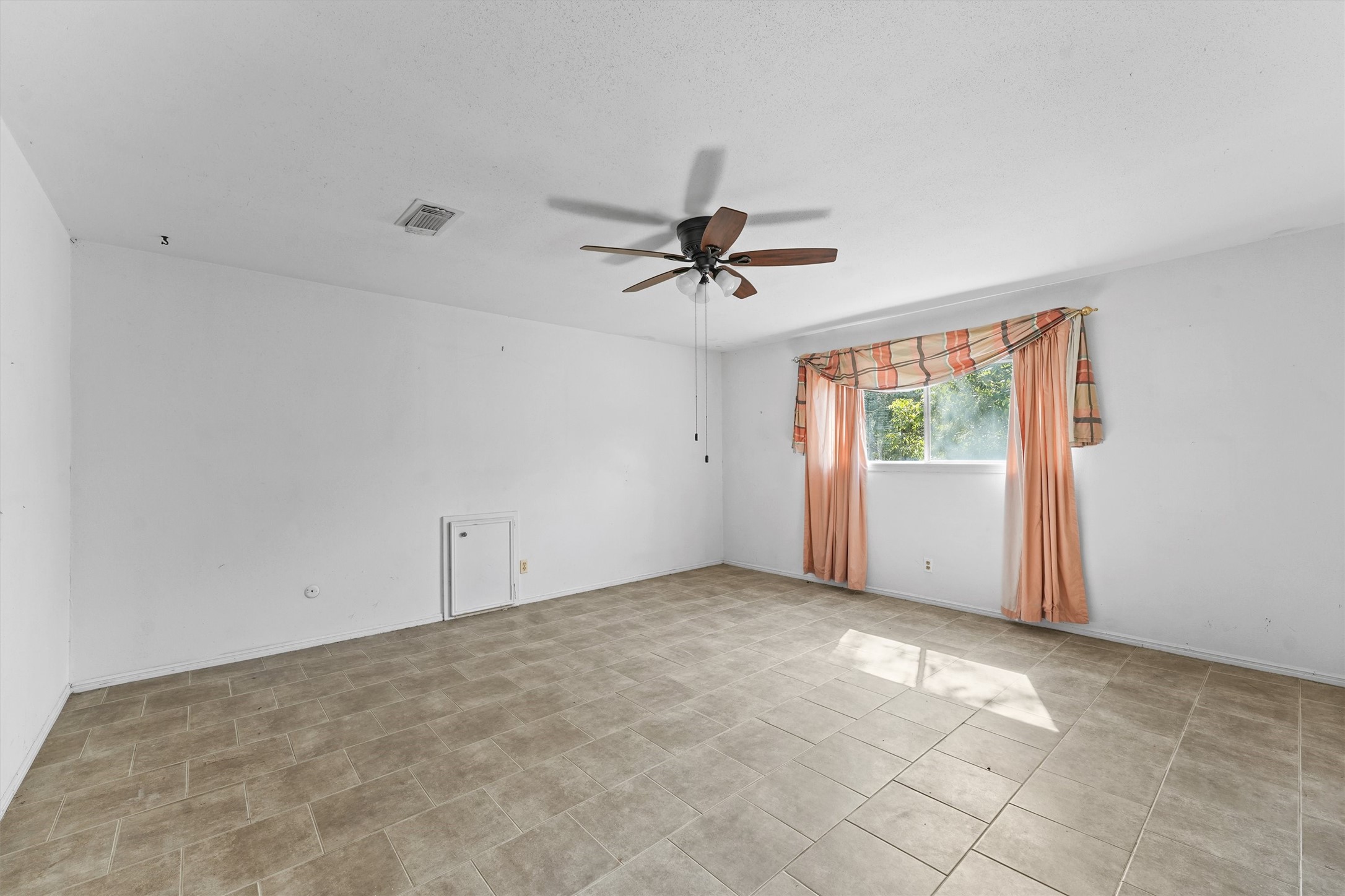 3930 Cypress Hill Drive Spring, TX 77388 - Photo 14 of 29 a view of a room with a ceiling fan and window