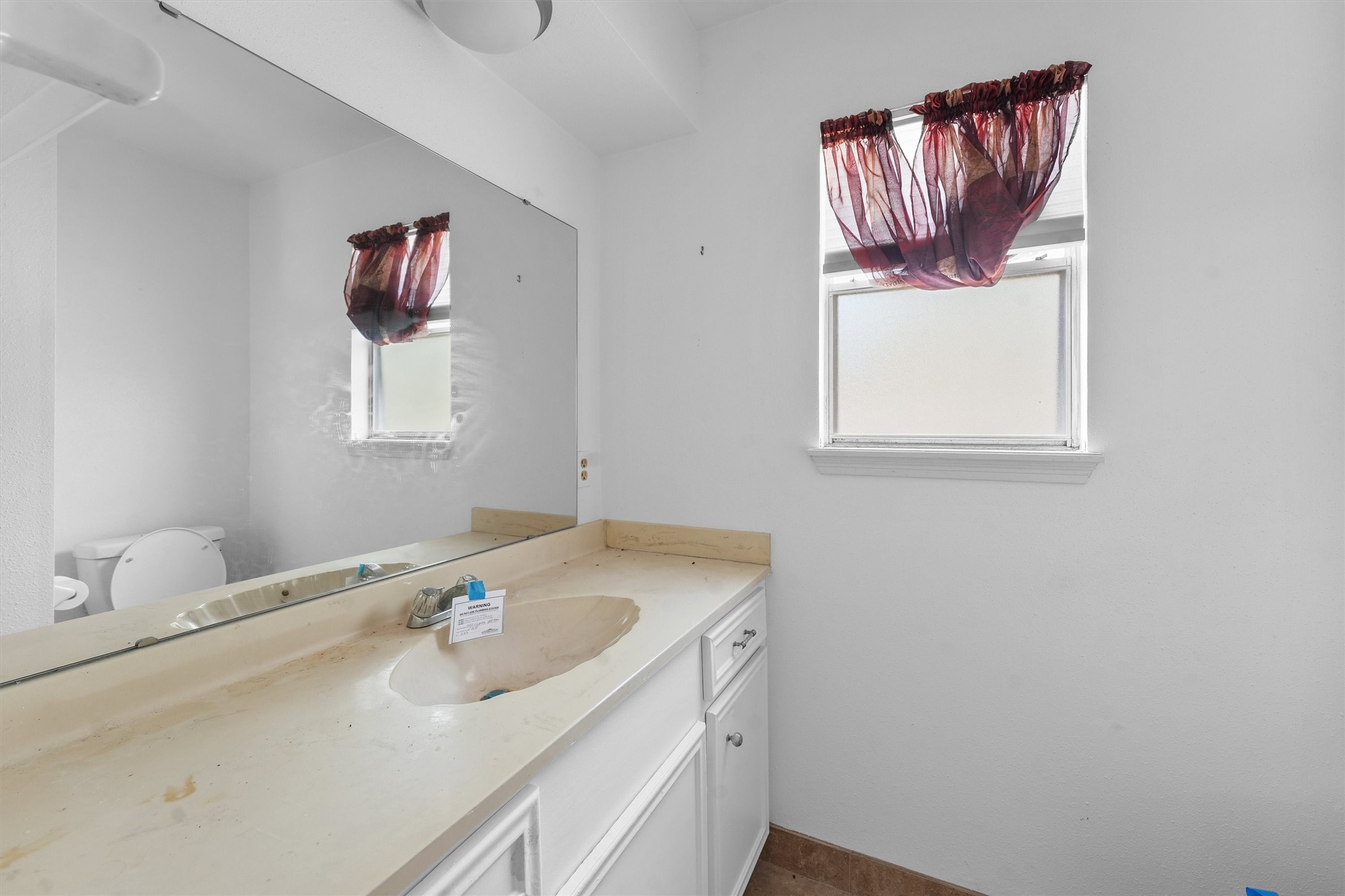 3930 Cypress Hill Drive Spring, TX 77388 - Photo 15 of 29 a bathroom with a sink and a mirror