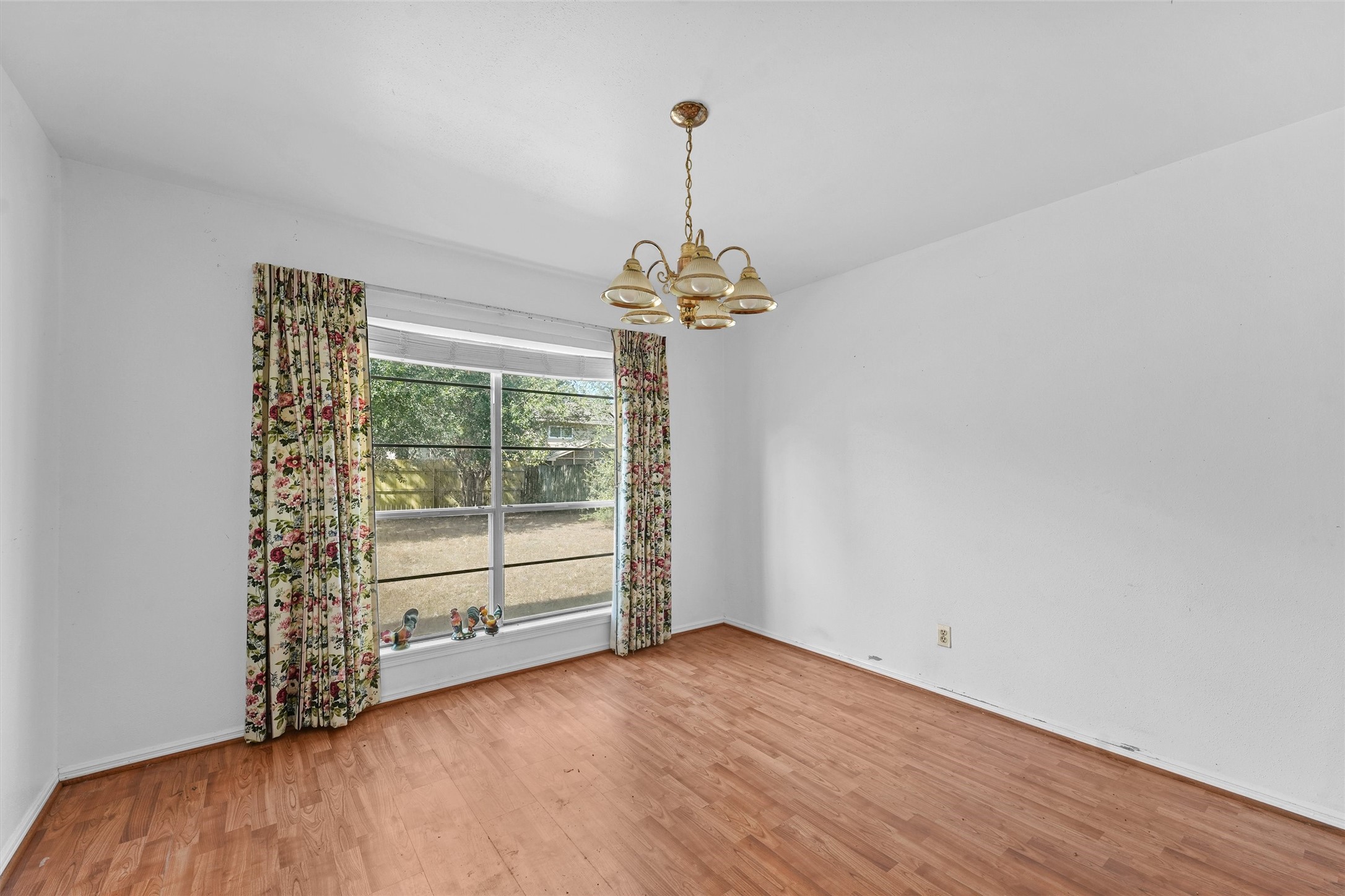 3930 Cypress Hill Drive Spring, TX 77388 - Photo 7 of 29 wooden floor in an empty room with a window