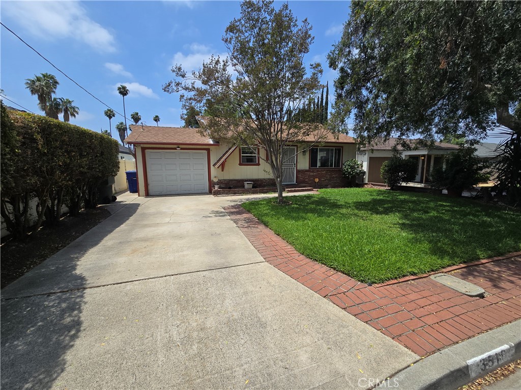 3516 McKinley Street Riverside, CA 92506 - Photo 2 of 6 Long front driveway leading to 1 car garage.