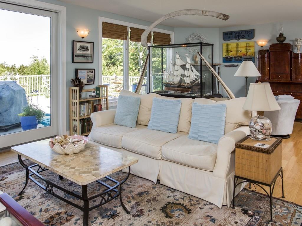 7 Spyglass Hl Road East Boothbay, ME 04544 - Photo 6 of 35 Living room with propane stove with...