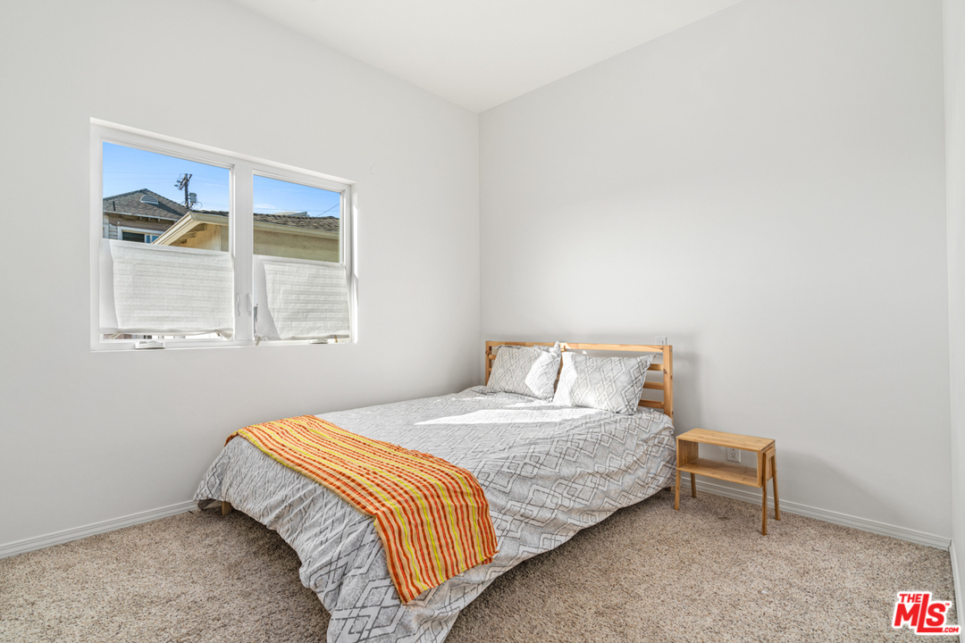 2275 Ewing Street Los Angeles, CA 90039 - Photo 11 of 19 a bedroom with a bed and a window