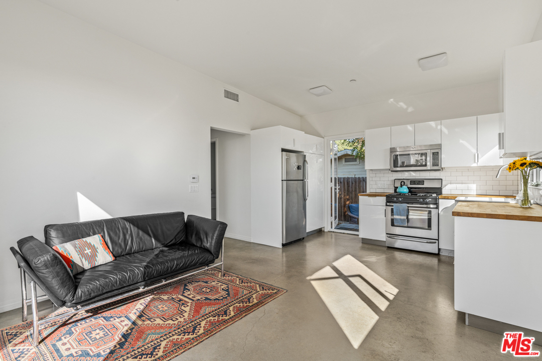 2275 Ewing Street Los Angeles, CA 90039 - Photo 5 of 19 a living room with furniture and a rug