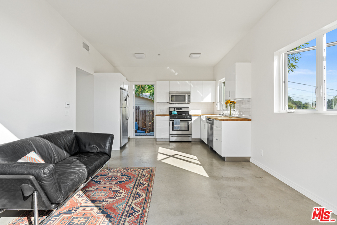 2275 Ewing Street Los Angeles, CA 90039 - Photo 6 of 19 a living room with furniture and kitchen view