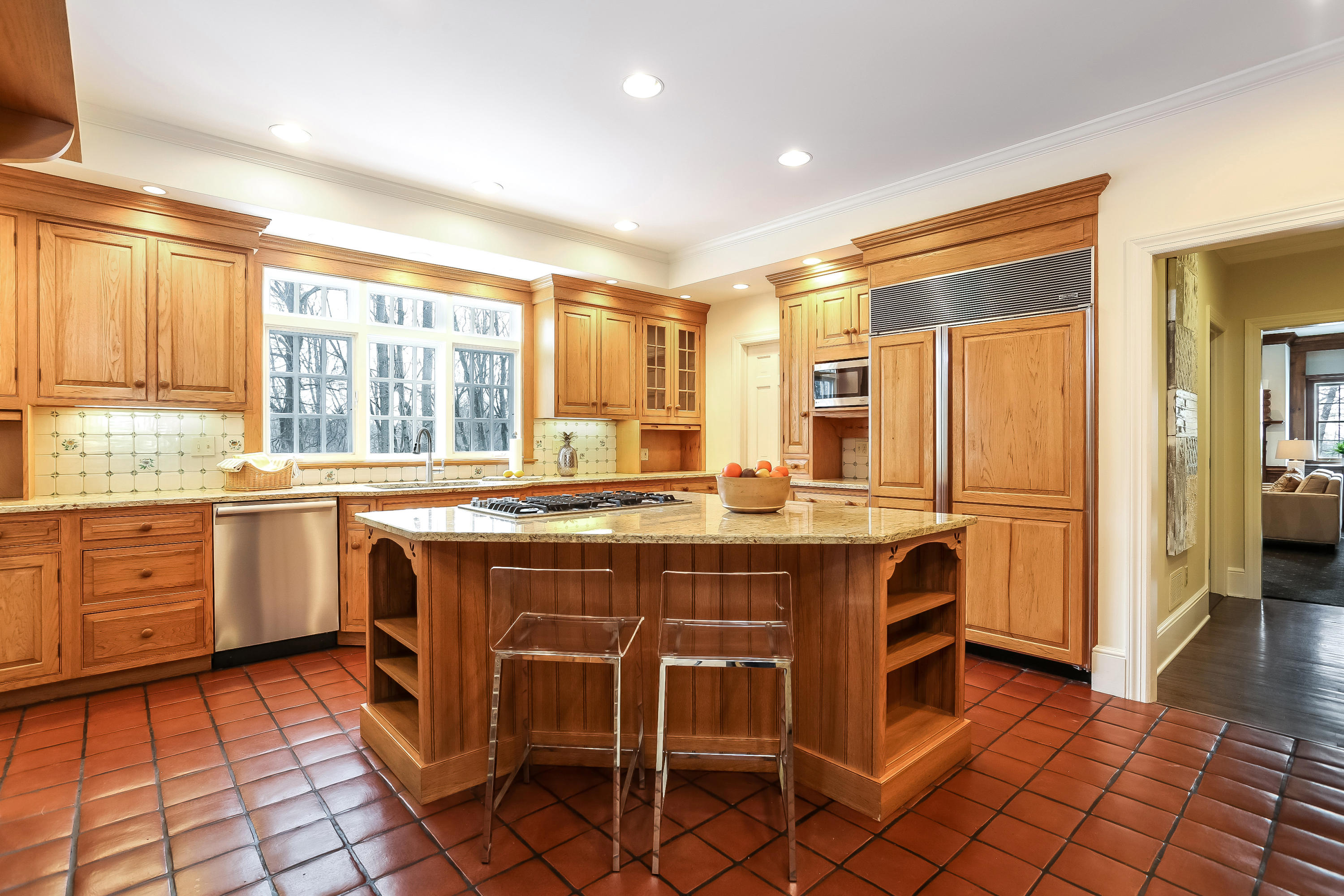 152 Marshall Ridge Road New Canaan, CT 06840 - Photo 11 of 34 a kitchen with a sink stove and cabinets