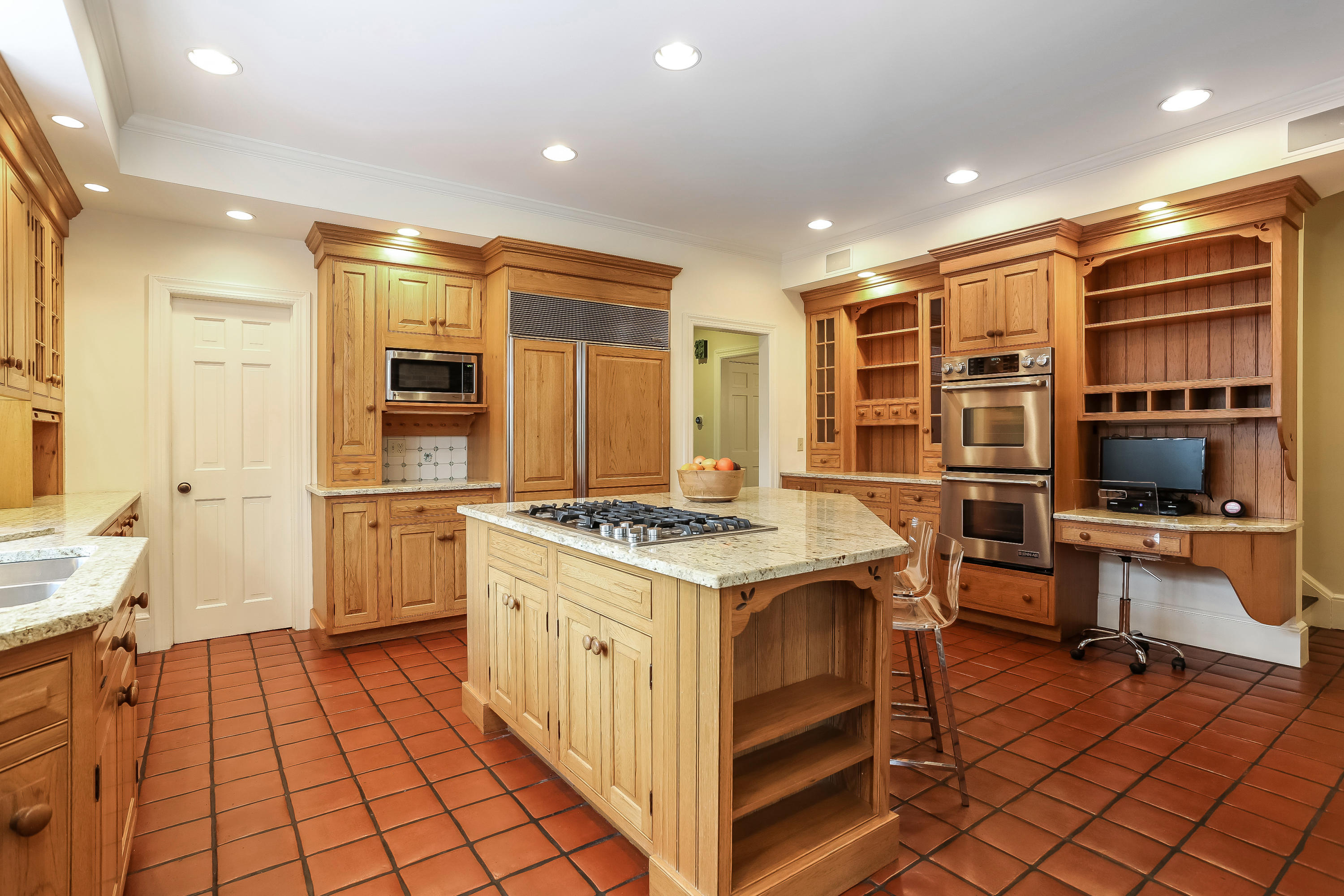 152 Marshall Ridge Road New Canaan, CT 06840 - Photo 12 of 34 a kitchen with a sink stove and cabinets