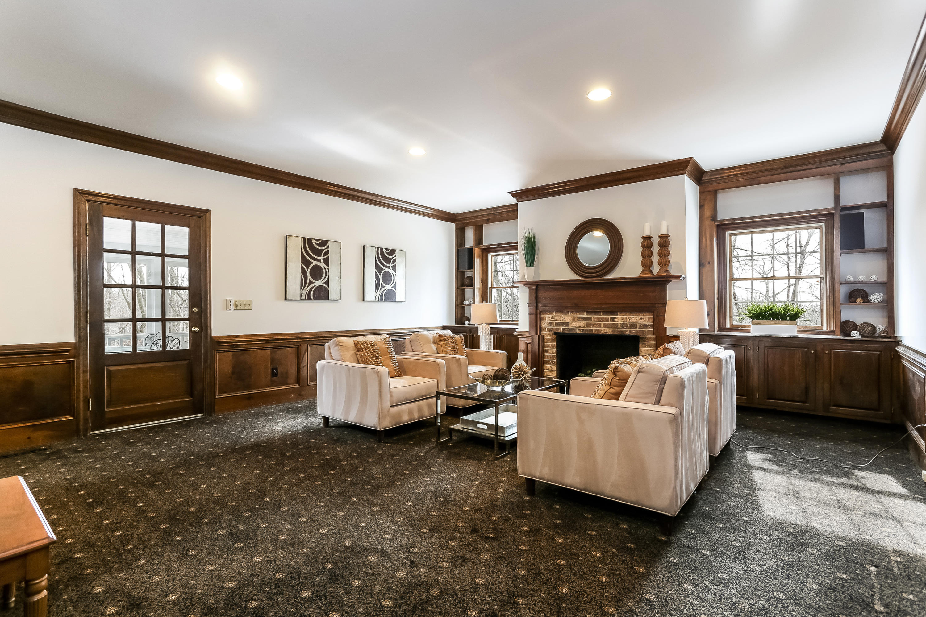 152 Marshall Ridge Road New Canaan, CT 06840 - Photo 13 of 34 a living room with furniture wooden floor and a fireplace