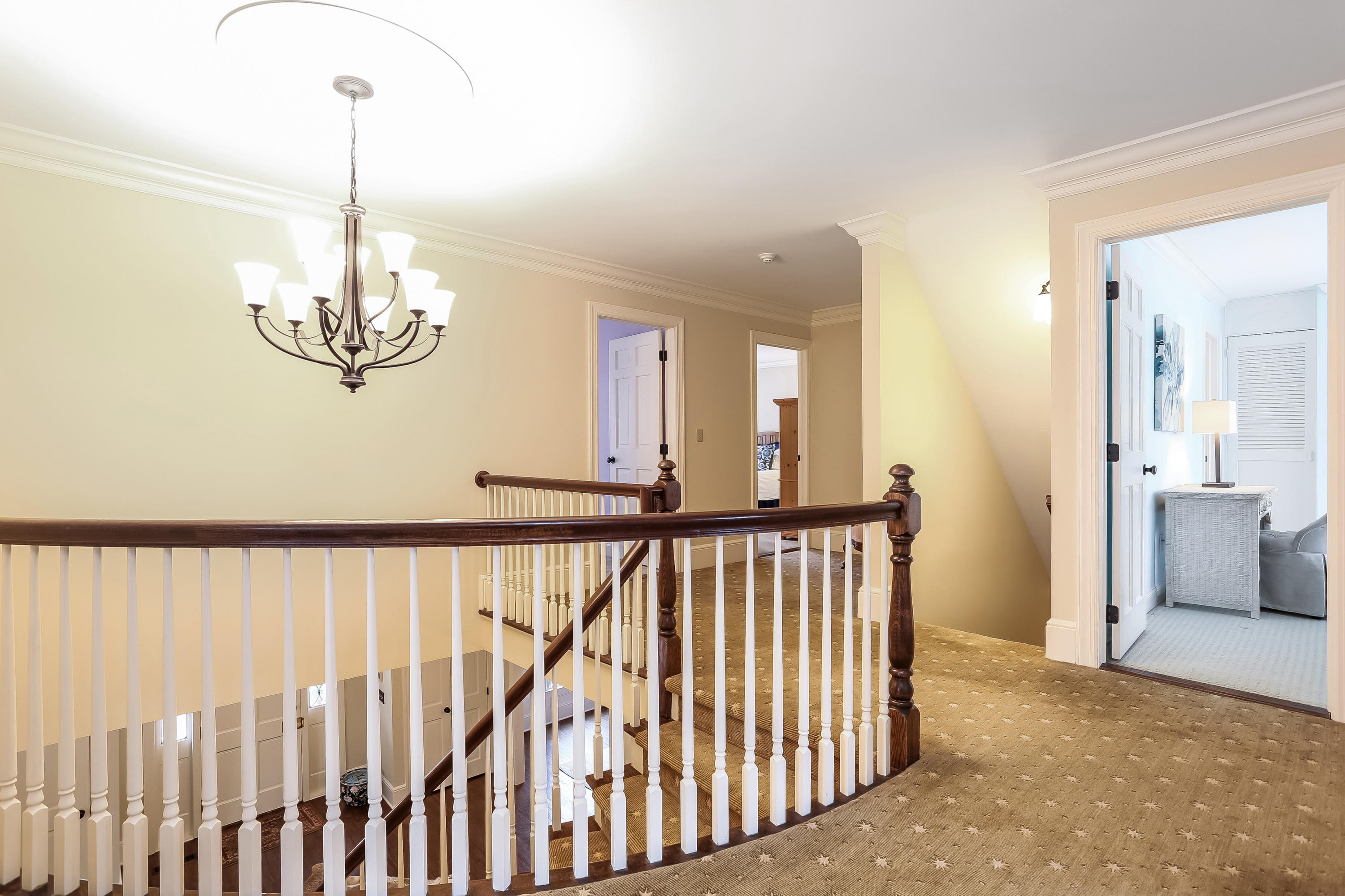 152 Marshall Ridge Road New Canaan, CT 06840 - Photo 17 of 34 a view of a hallway with chandelier