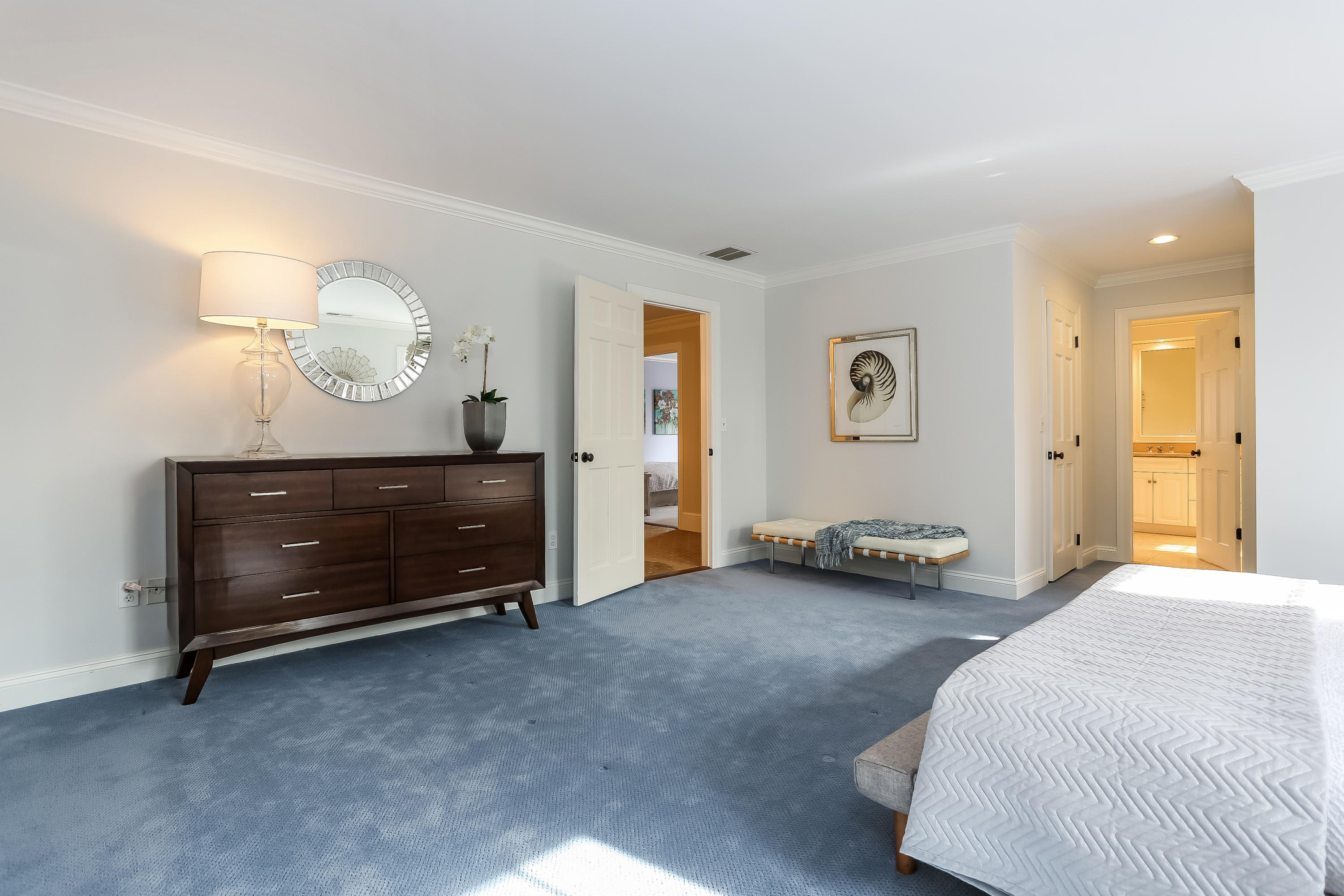 152 Marshall Ridge Road New Canaan, CT 06840 - Photo 18 of 34 a bedroom with a bed and a table