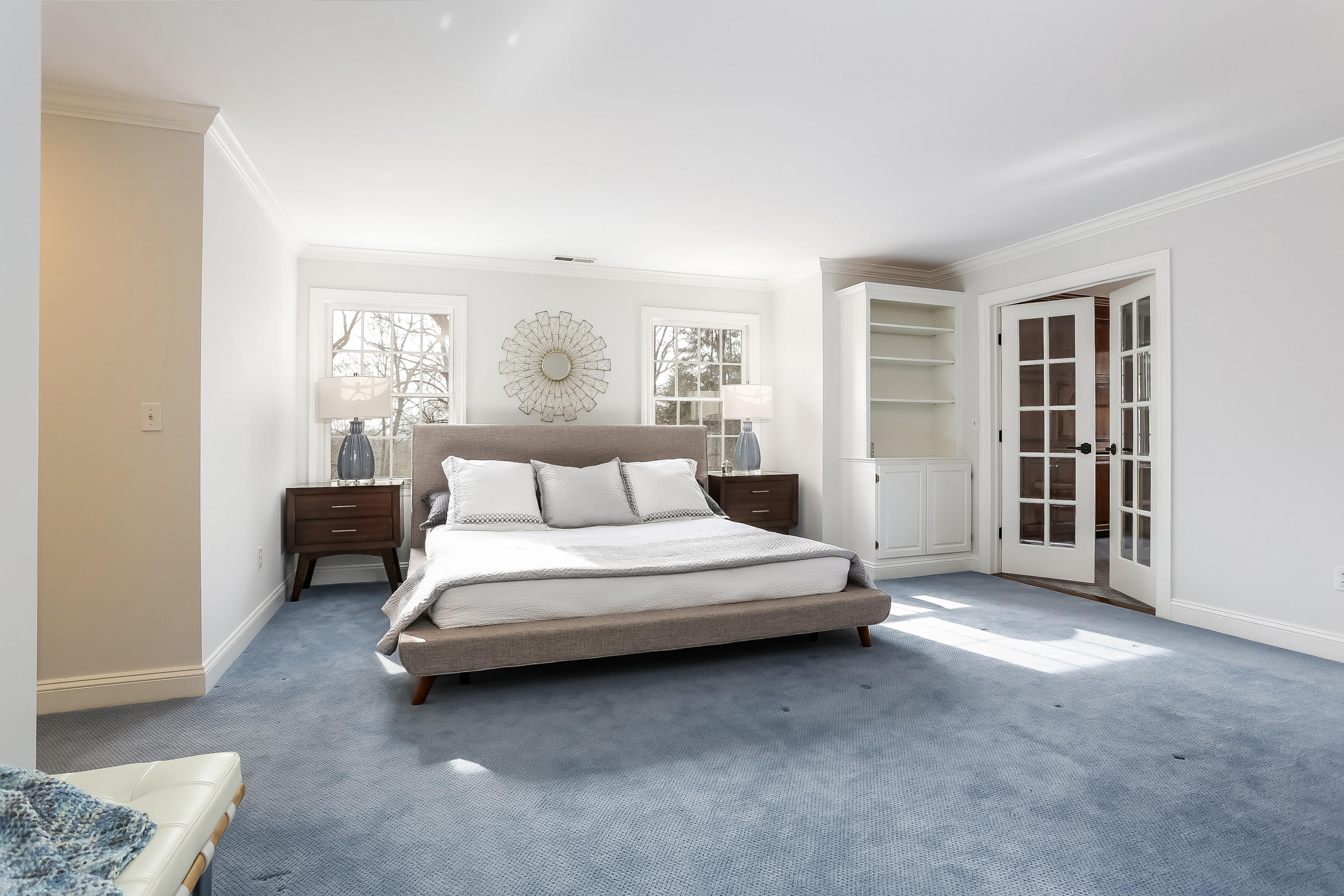 152 Marshall Ridge Road New Canaan, CT 06840 - Photo 19 of 34 a spacious bedroom with a bed and a window