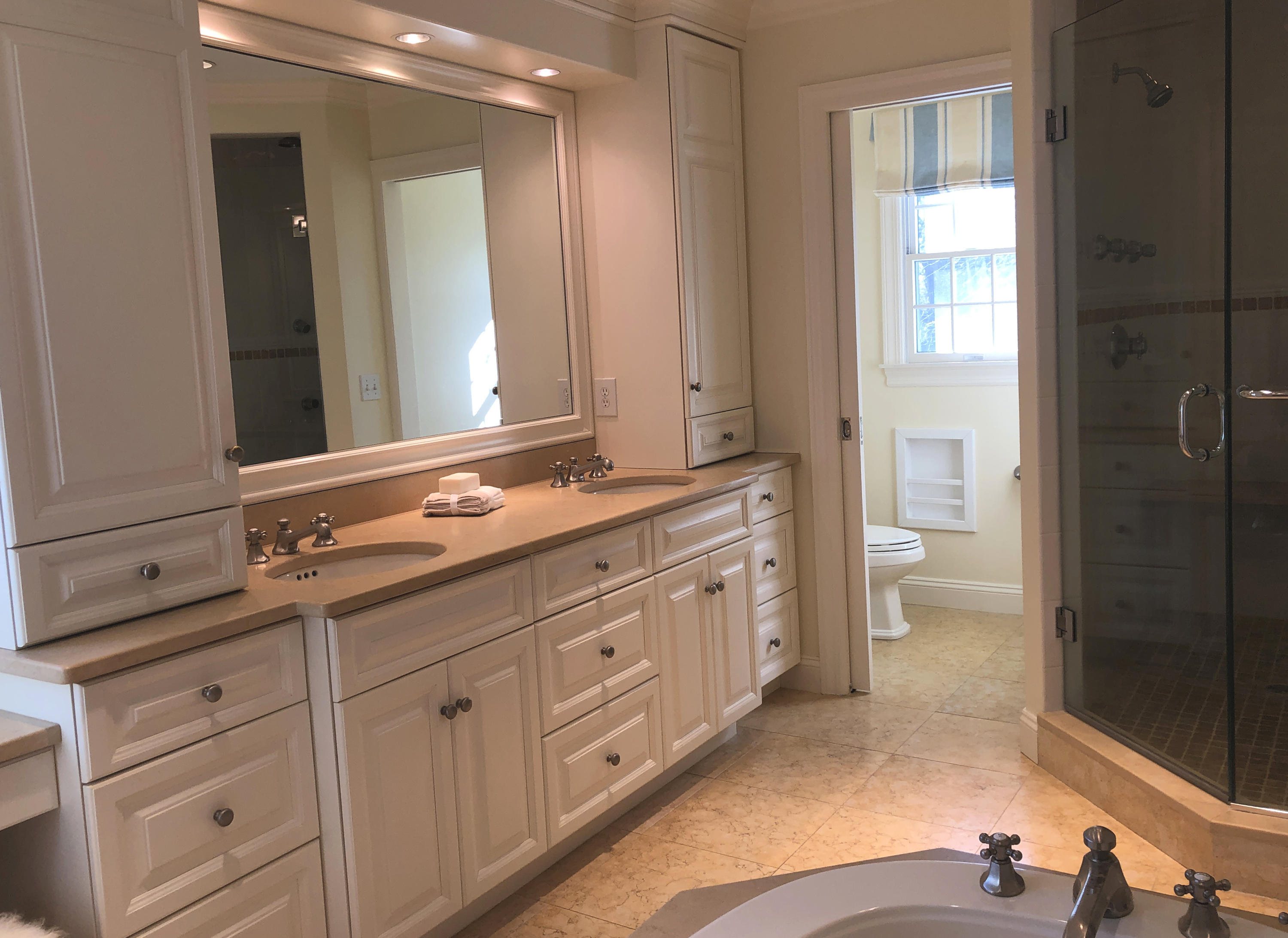 152 Marshall Ridge Road New Canaan, CT 06840 - Photo 20 of 34 a bathroom with a sink a toilet and shower