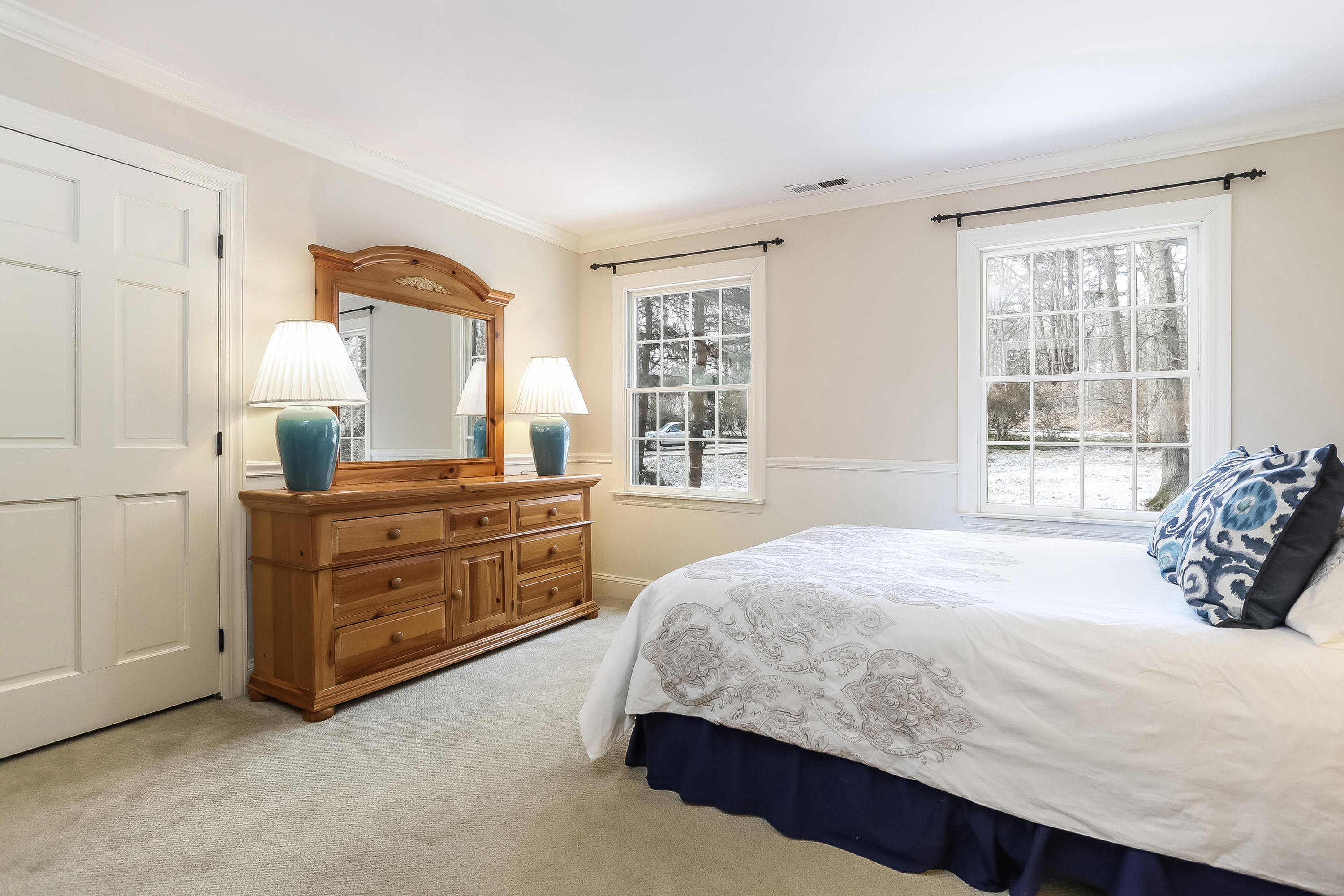 152 Marshall Ridge Road New Canaan, CT 06840 - Photo 25 of 34 a bedroom with a bed and a dresser