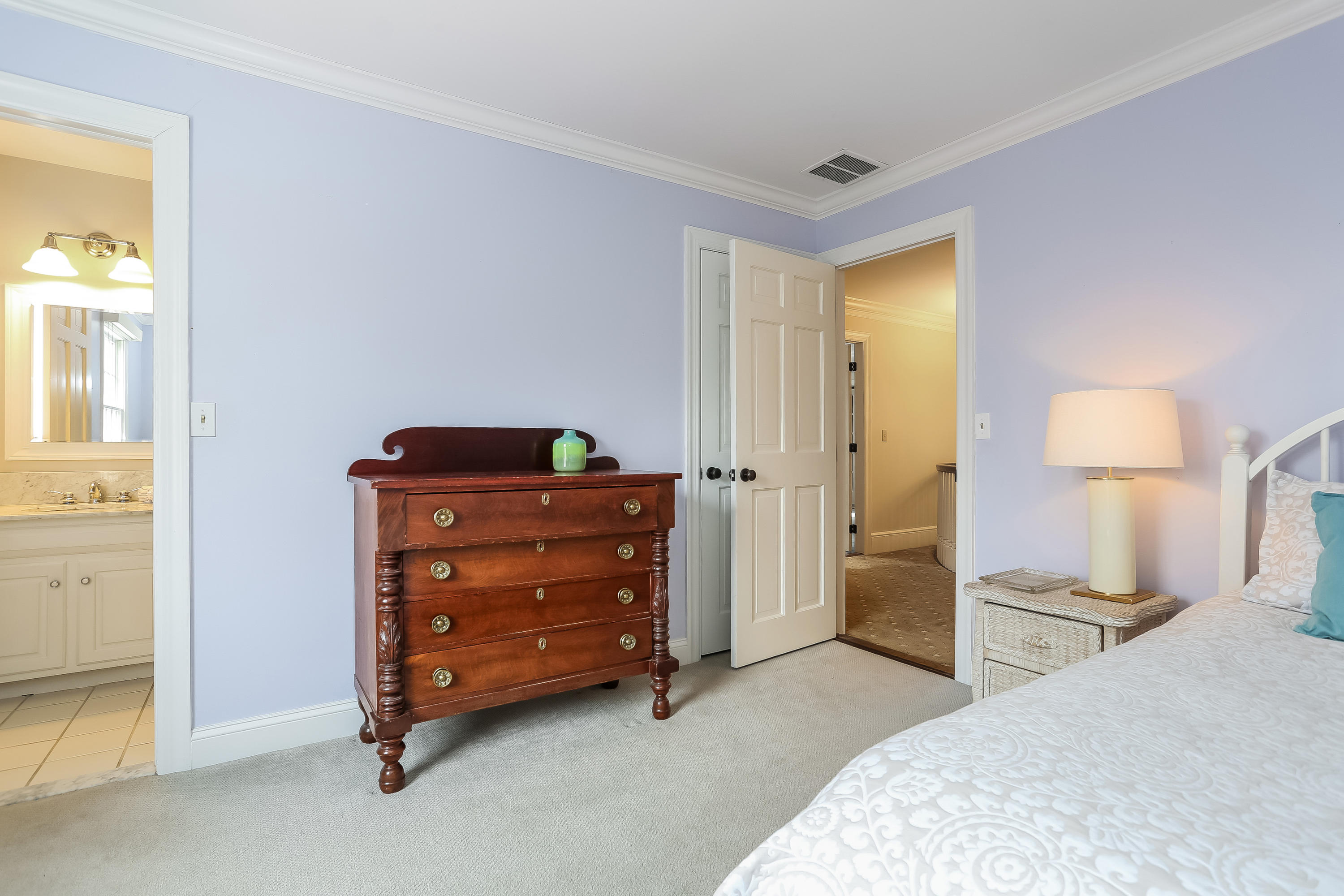 152 Marshall Ridge Road New Canaan, CT 06840 - Photo 26 of 34 a bedroom with a bed and a table