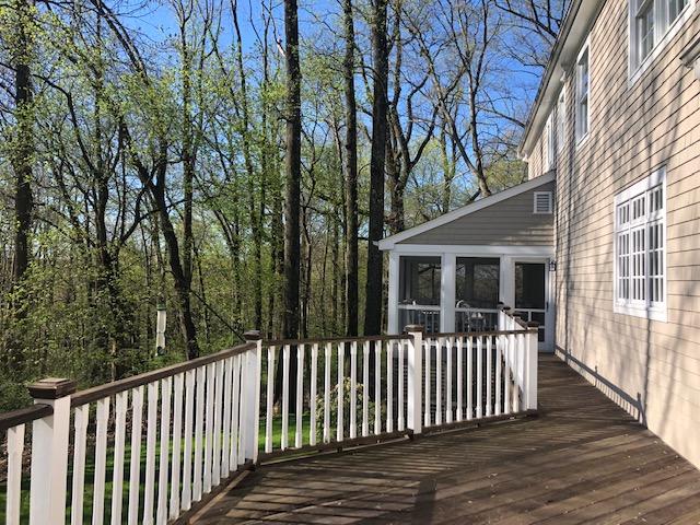 152 Marshall Ridge Road New Canaan, CT 06840 - Photo 30 of 34 a view of a house with a wooden deck