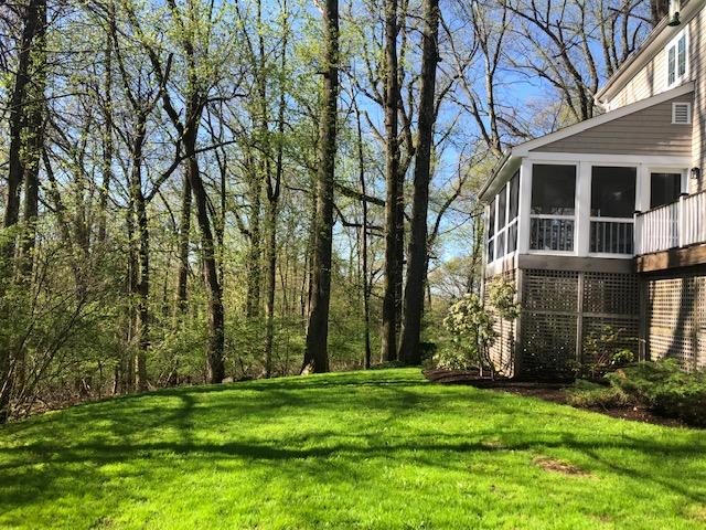152 Marshall Ridge Road New Canaan, CT 06840 - Photo 33 of 34 a backyard of a house with lots of green space
