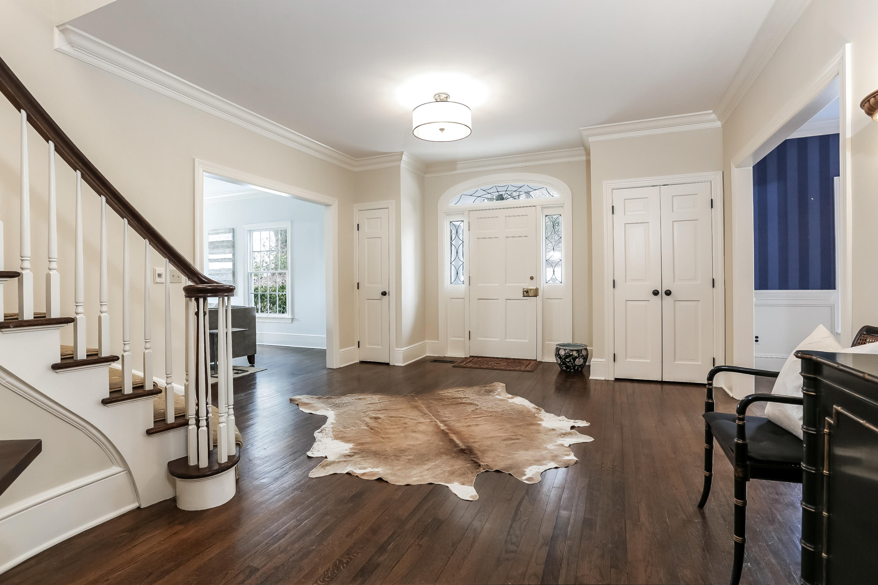152 Marshall Ridge Road New Canaan, CT 06840 - Photo 5 of 34 a view of a hallway with wooden floor and staircase