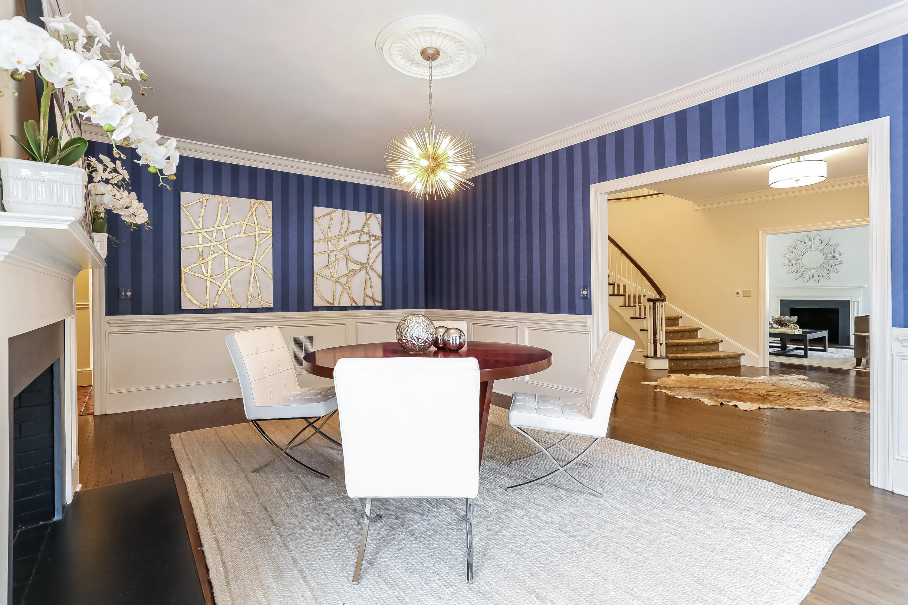 152 Marshall Ridge Road New Canaan, CT 06840 - Photo 9 of 34 a view of a dining room with furniture and a chandelier